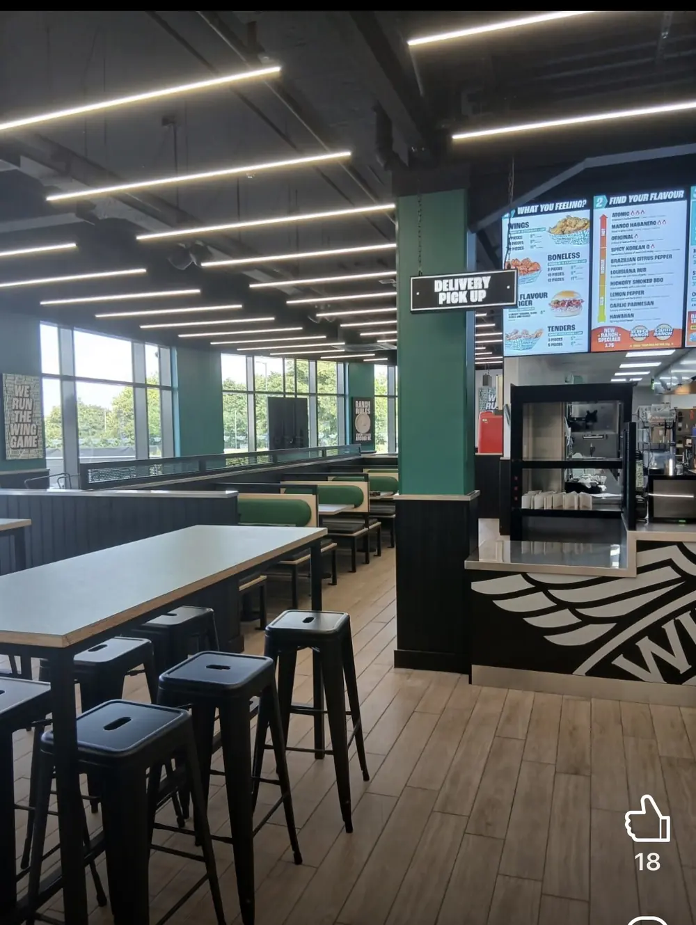 Wingstop Rushmere interior seating, linear lighting and green brand columns
